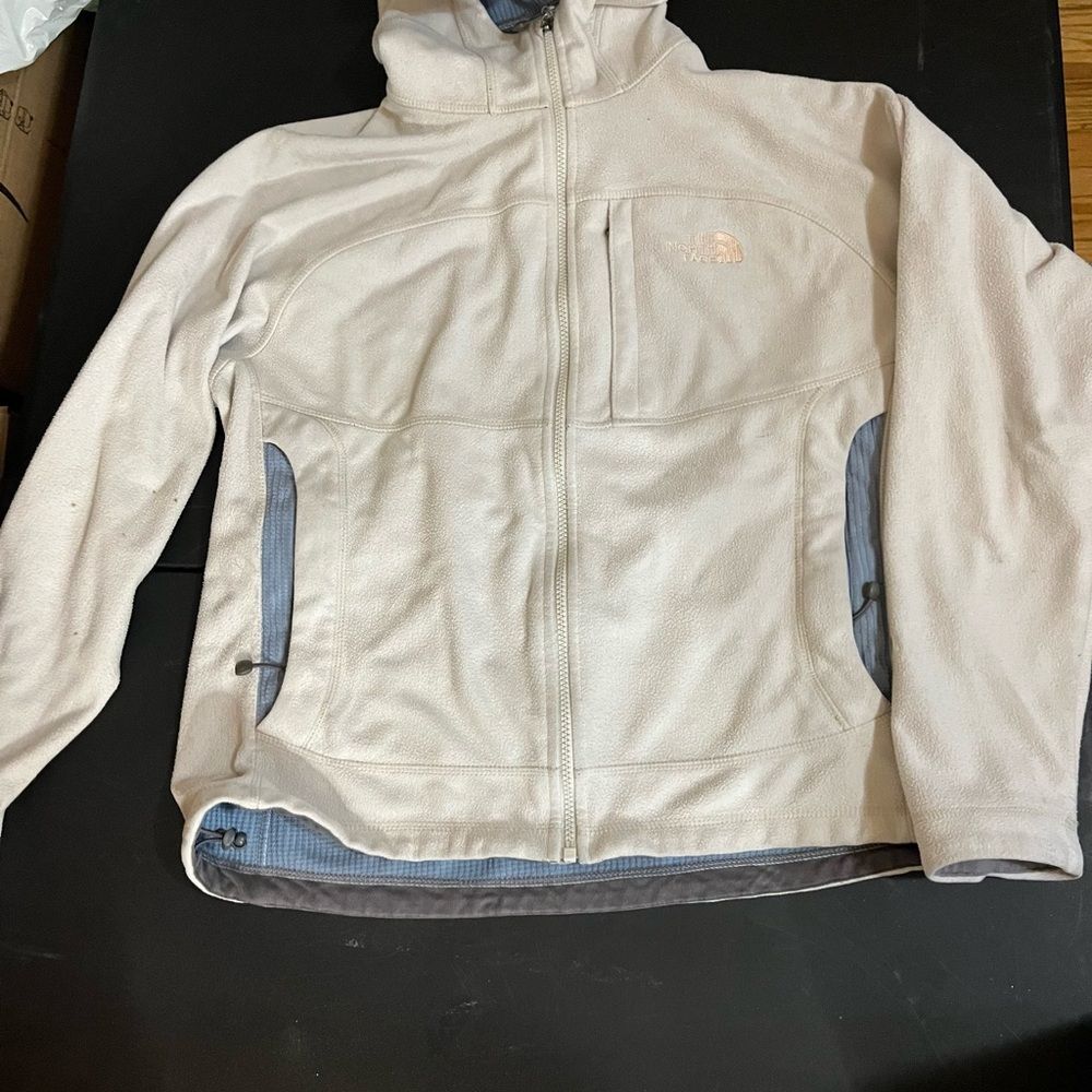 The North Face Cream and Gray Fleece Jacket woman’s size large shows some wear